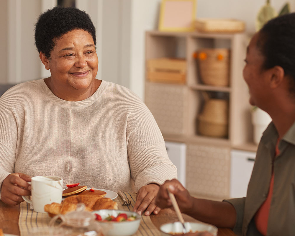 Two women eating breakfast together